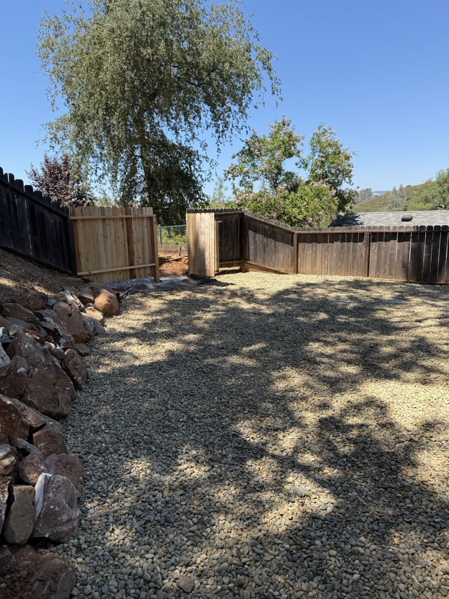 Clearing vegetation and gravel around a structure for fire safety
