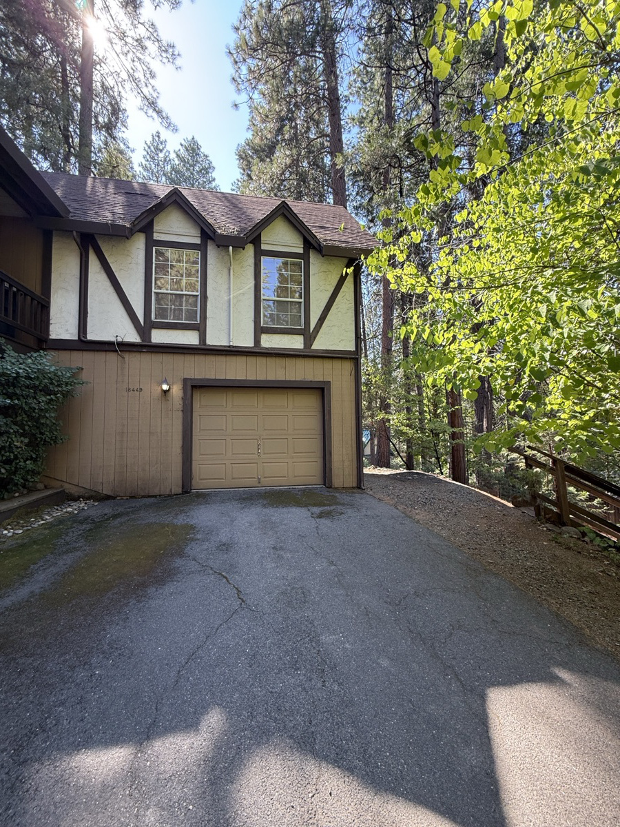 Defensible space clearing around a home perimeter in Tuolumne County