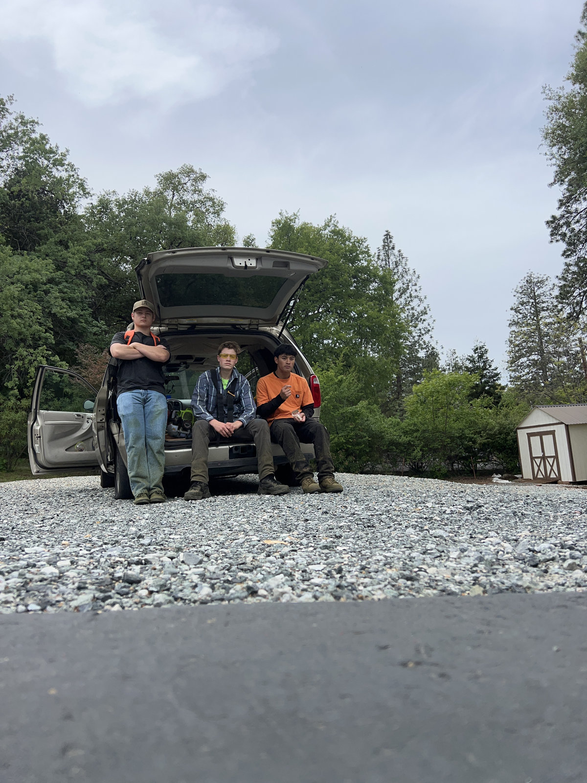 Wacky Weedeating crew taking a break on the tailgate