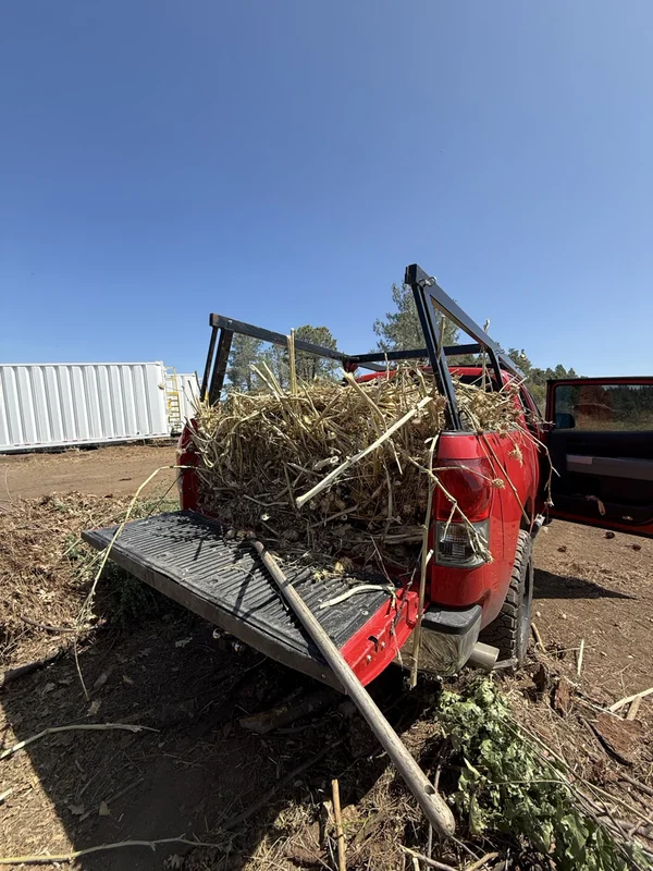 Tractor loading debris for removal