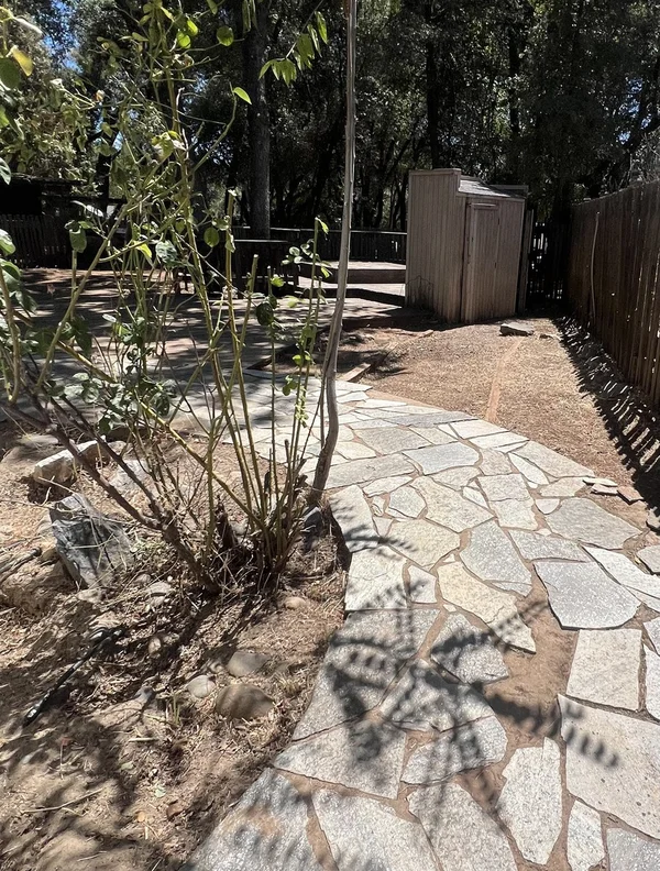 Flagstone pathway landscaping in a yard